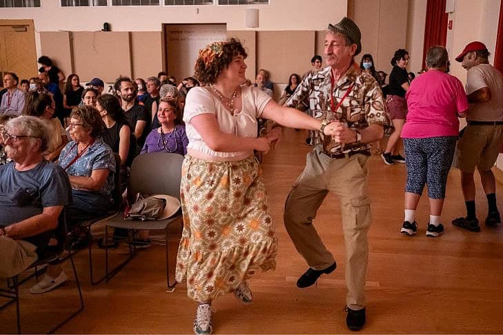 Man and Woman Dancing to Klezmer Music